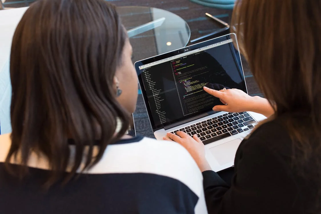 Laptop screen showing Oleeo candidate matching software with a person looking at it