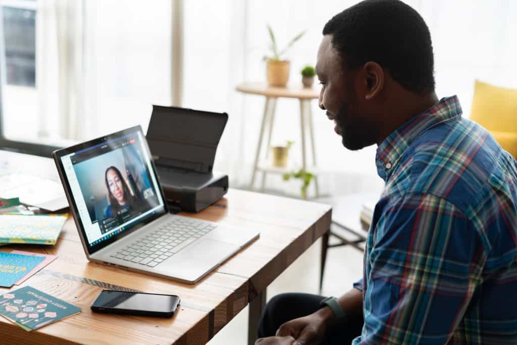 Male having a virtual interview with woman