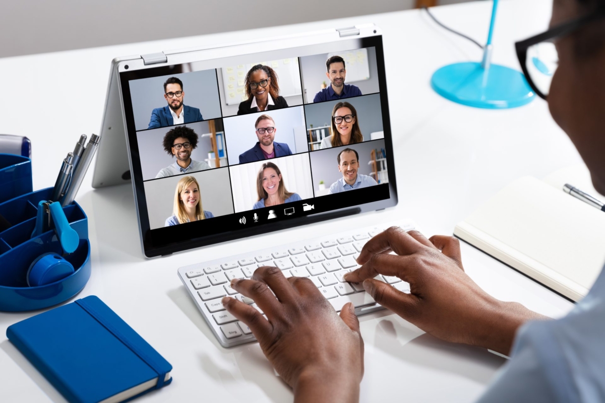 Woman Working From Home Having Group Videoconference On Laptop